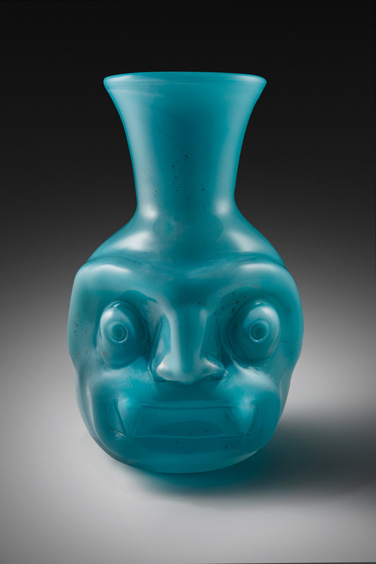 Tlaloc Vasija, turquoise glass vessel with a sculpted face by Manolo Aguilera