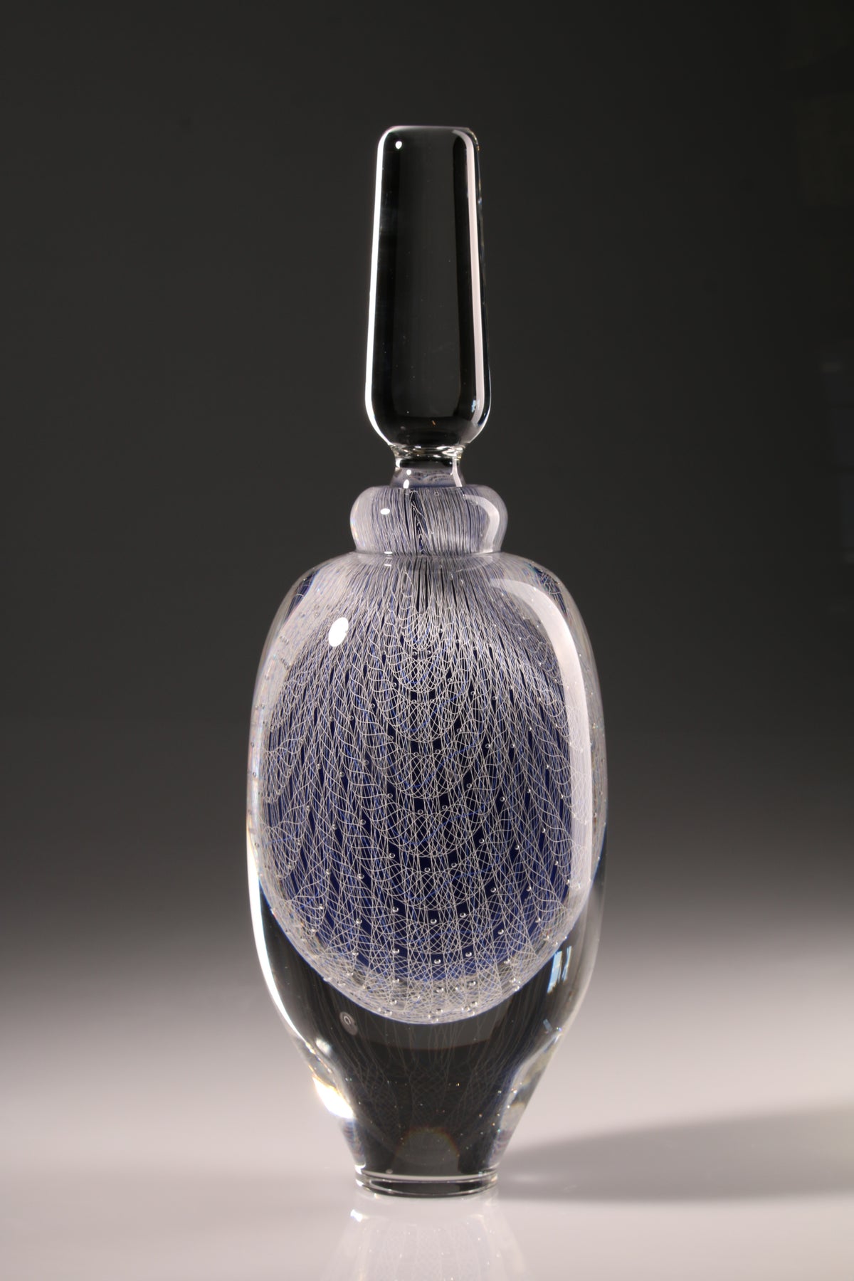 Peter Bowles, Lines of Inquiry: White Filligree, glass stoppered bottle with fine white cane work.