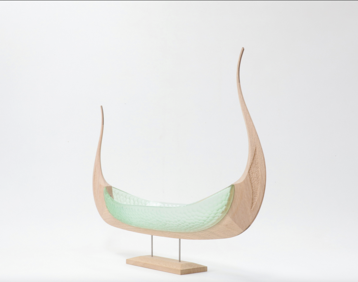 Balder, sea-green glass and light oak Viking ship sculpture, angled view