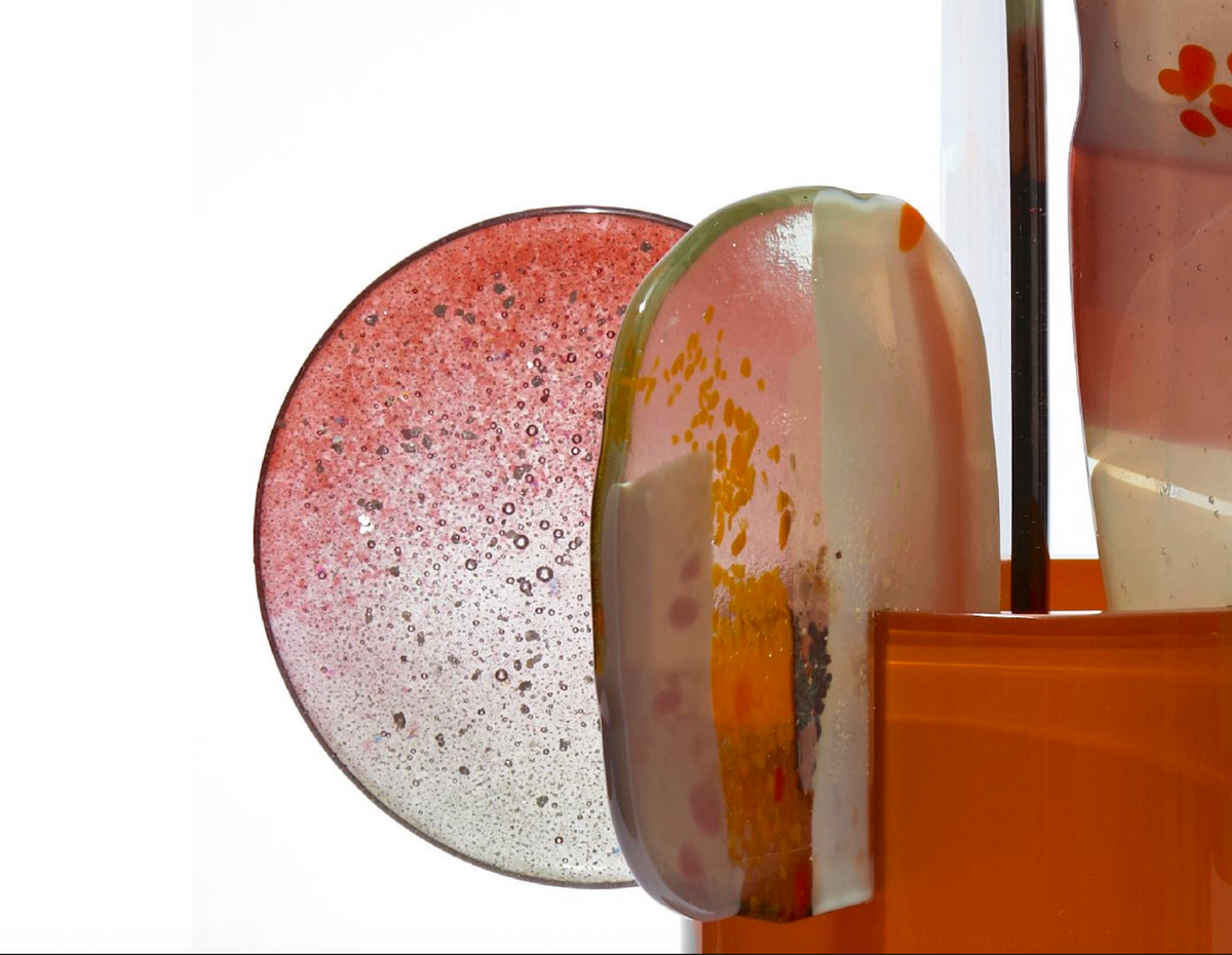 Detail of Canna by Amy Cushing, showing pink and amber translucent glass finials and bubble textures.